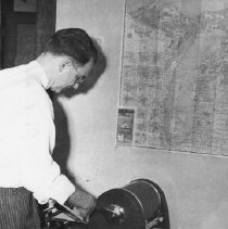 Don Droste, Secretary of Chamber of Commerce, is preparing mail for the ann